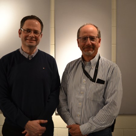 Jeff Awid (left) and Sergeant David Hawthorne (right) at the Edmonton Police headquarters.