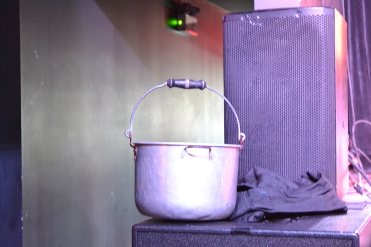 A metal bucket sits on a ledge.