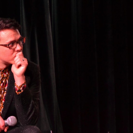 Chris listens in with a microphone.