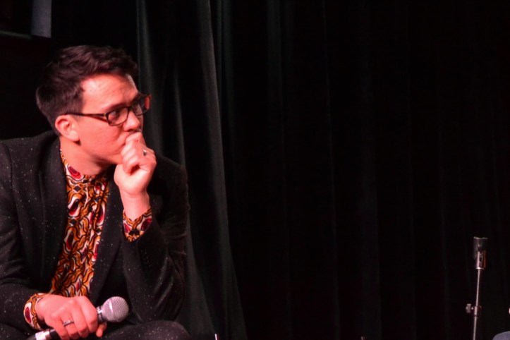 Chris listens in with a microphone.