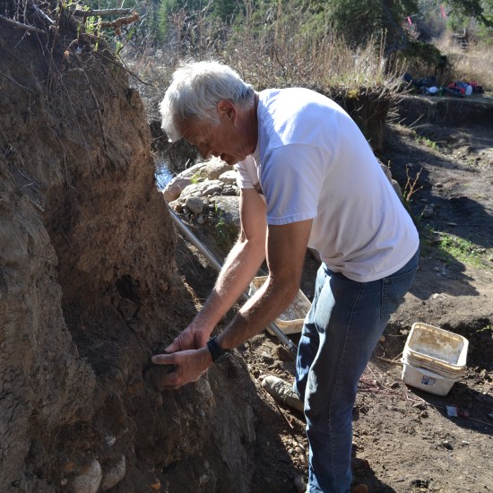 Phil Currie digging away at the quarry wall.