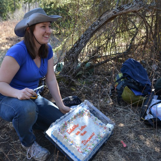 Caroline and her cake. It says "Trilobites are better than dinosaurs."