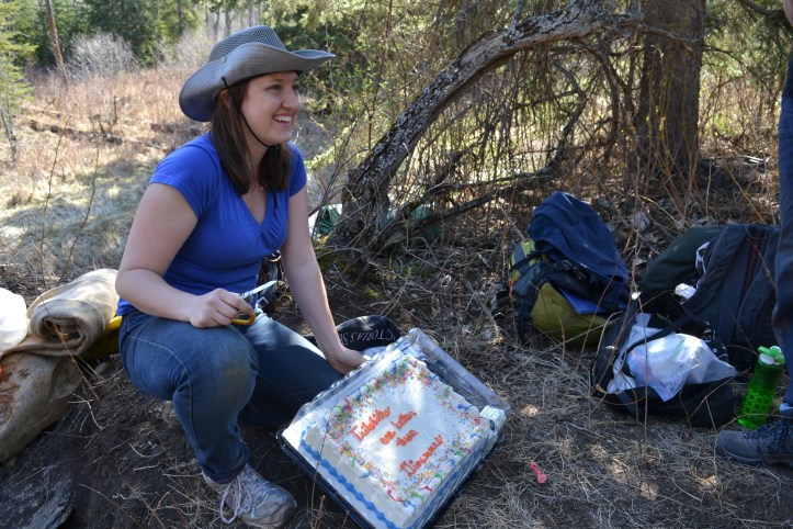 Caroline and her cake. It says "Trilobites are better than dinosaurs."