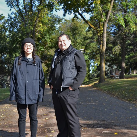 Lauren Crazybull and Chief Calvin Bruneau at the Mount Pleasant Cemetery.