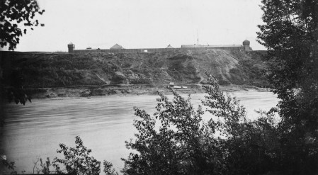 Fort Edmonton sits on top of the river bank in this photo from the south side of the river (City of Edmonton Archives EA-10-3248)