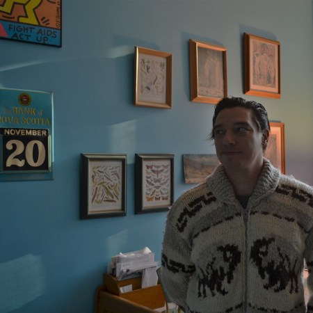 David Lewkowich in his office at the University of Alberta. His great-uncle Casimir's William Blake prints are hanging behind him.