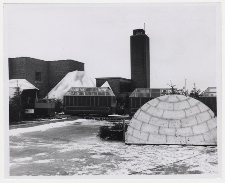 The train runs behind a prop igloo on the roof [Hudson's Bay Company Archives, HBCA 1987-363-E-610 - 52]
