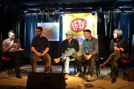 The panelists on stage again.