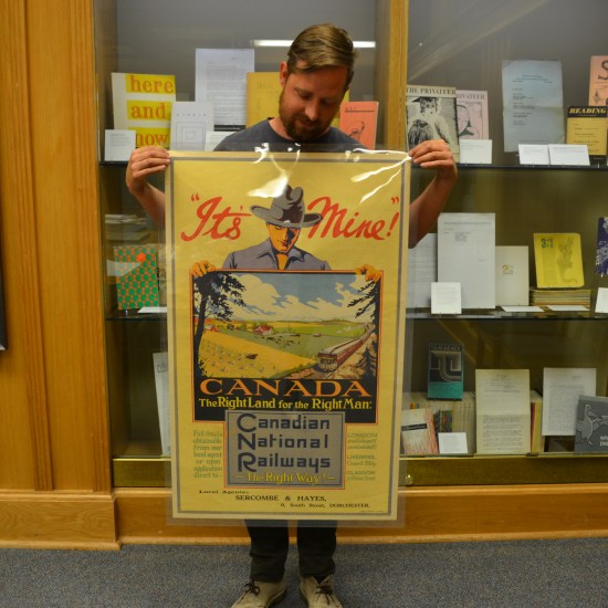 The poster reads: It's Mine! And a man holds a picture of a prairie farmstead.