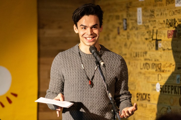 Hunter Cardinal smiles on stage