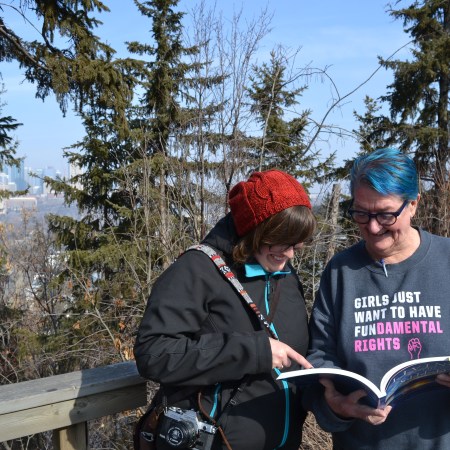Amandah and Billie look at Billie's book, Living in the Shed
