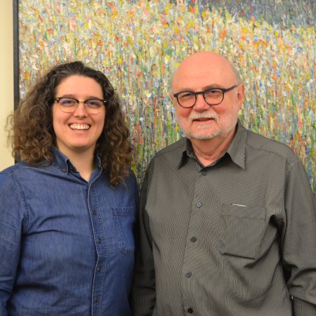 Jars and Alison in front of a pointilist landscape painting