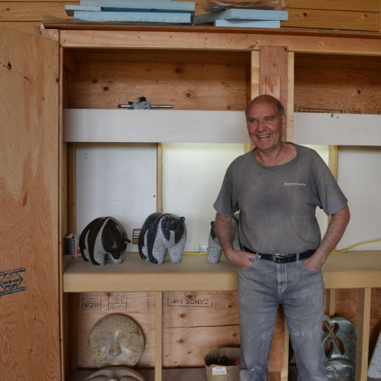 Stewart Steinhauer in front of some spare bear carvings