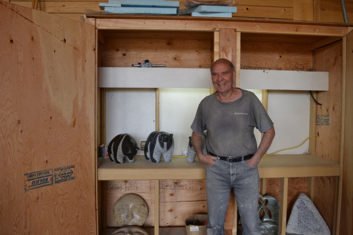 Stewart Steinhauer in front of some spare bear carvings