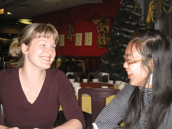 Grace and a friend smile at each other