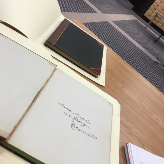photograph of two of annie york secord's diaries, sitting on a desk at the City of Edmonton Archives