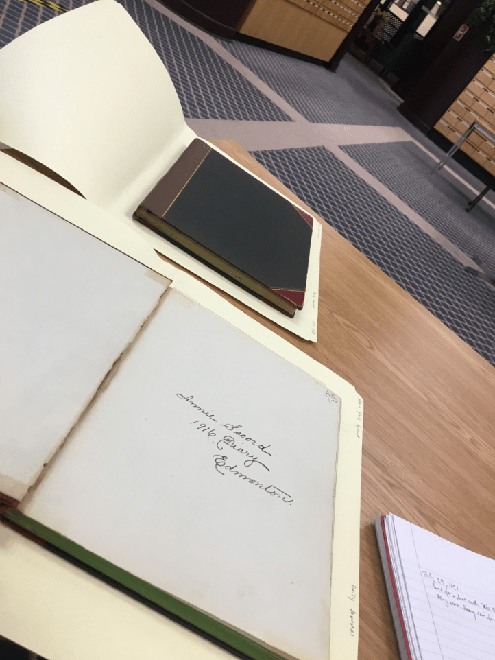 photograph of two of annie york secord's diaries, sitting on a desk at the City of Edmonton Archives