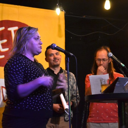 Fawnda Mithrush from the Alberta Podcast Network speaking to the crowd