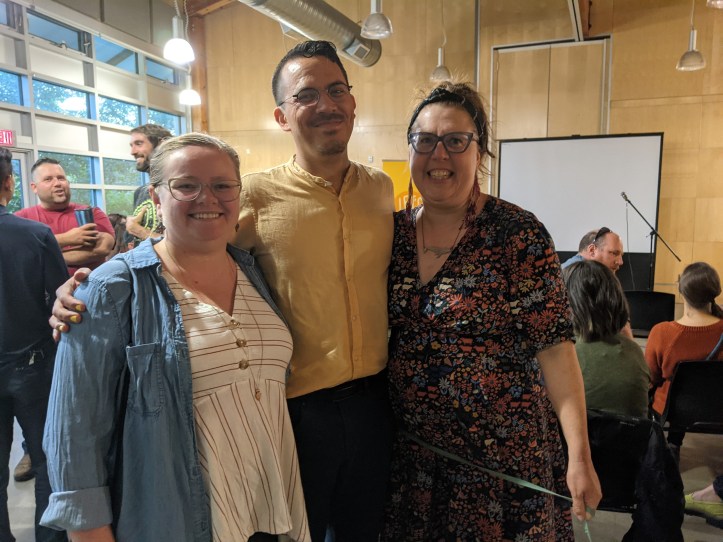 Shelley, Chris, and Kyla stand smiling.